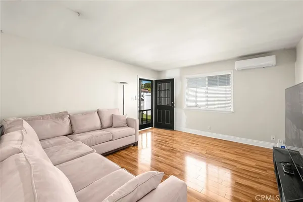 a living room with furniture and window