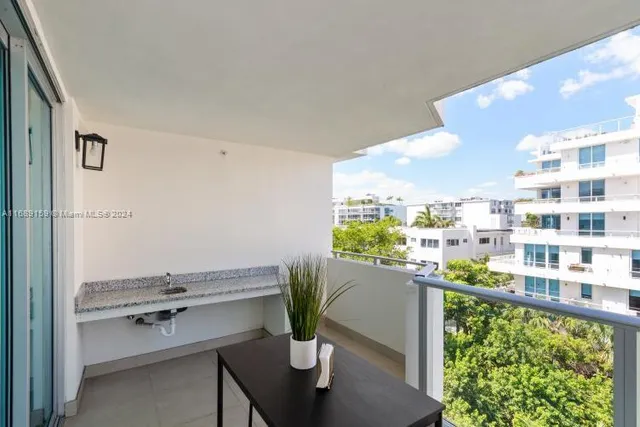 a view of a balcony with chairs