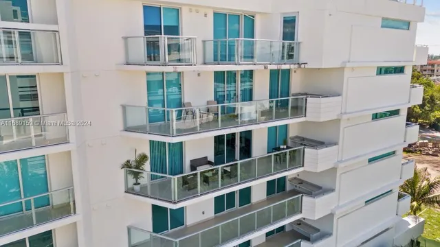 a front view of a building with a lot of windows