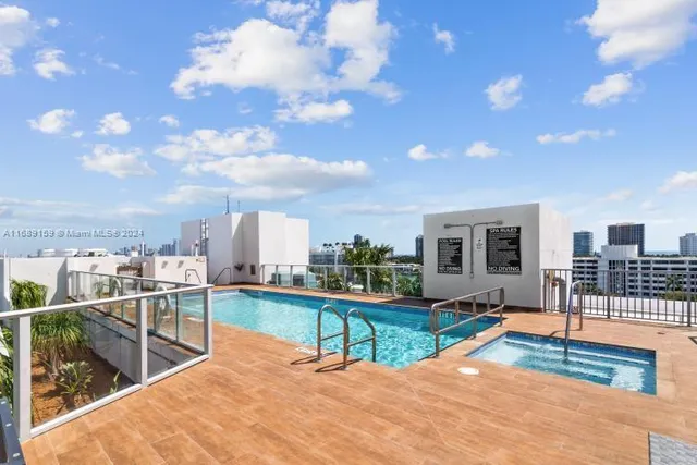 a view of a terrace with wooden floor and city view