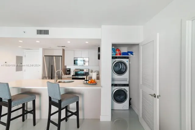 a view of dining room cabinets and window
