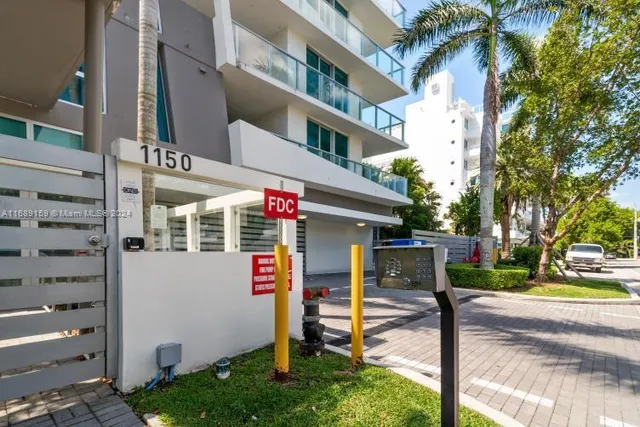 a front view of a house with a yard and a garage