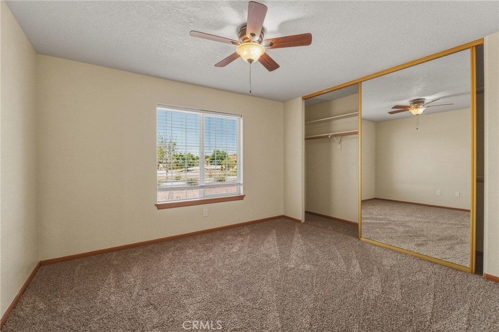 19501 Kinai Road Apple Valley, CA 92307 - Photo 34 of 49 a view of an empty room with a window