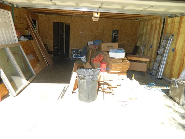 a view of living room with furniture and a rug