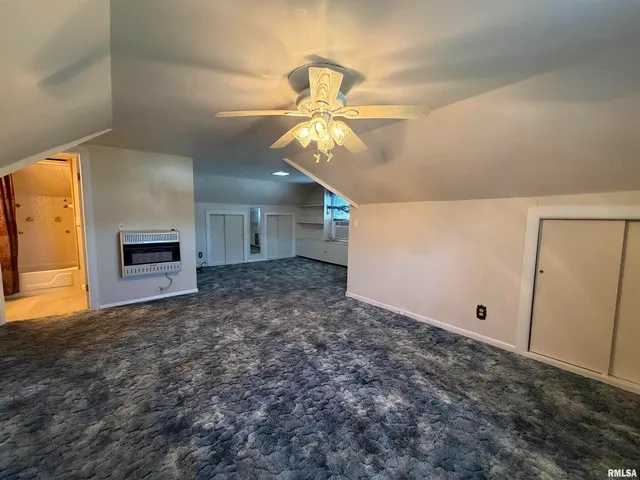 a very nice looking room with a ceiling fan