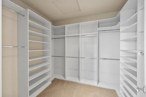 a bathroom with a double vanity sink toilet and shower