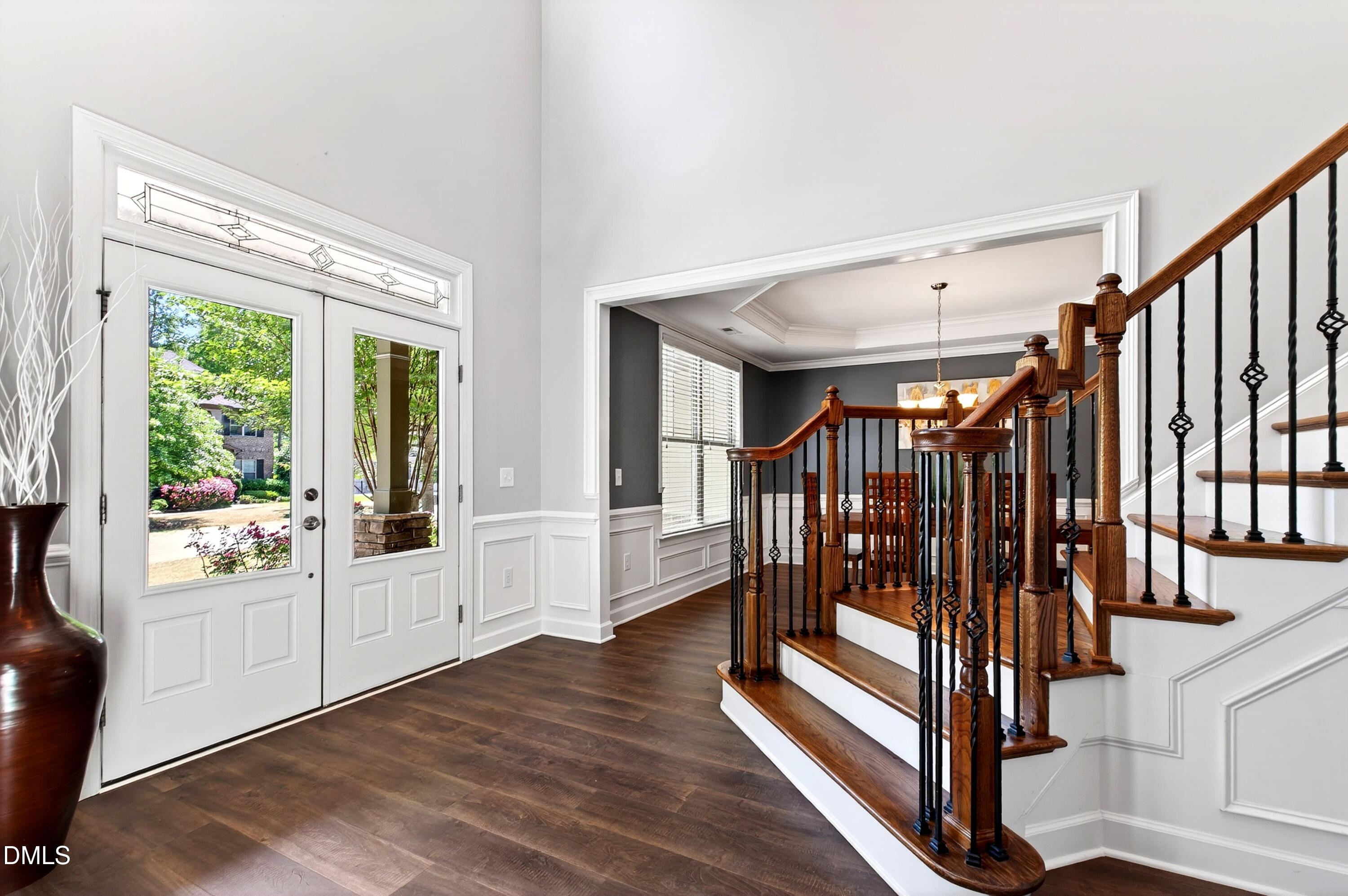 313 Karpen Lane Cary, NC 27519 - Photo 13 of 86 a view of entryway with wooden floor and stairs