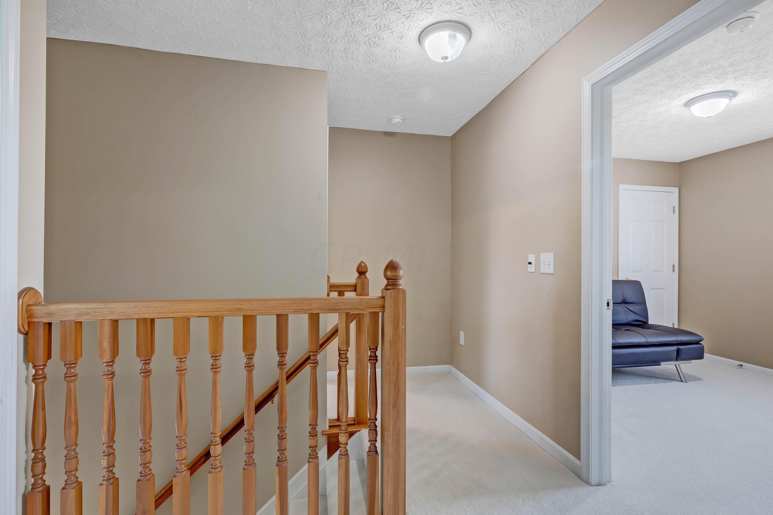 2136 Reeves Avenue Lewis Center, OH 43035 - Photo 24 of 57 • New Light Sand Carpet ~ 2018 • Tan Painted Walls • Ceiling Light • Attic Access