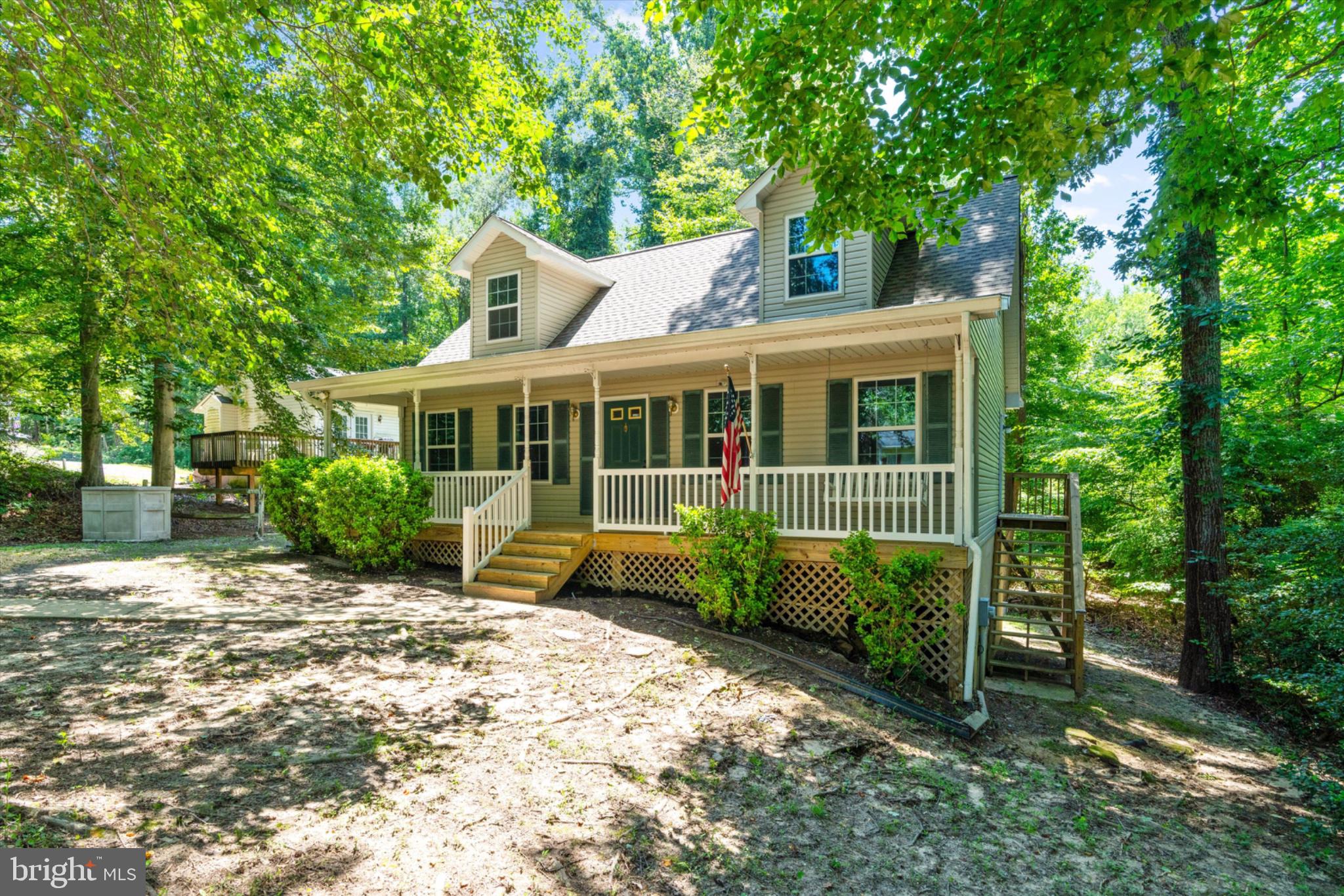 11500 Big Sandy Run Road Lusby, MD 20657 - Photo 3 of 57 Charming home nestled in lush greenery.