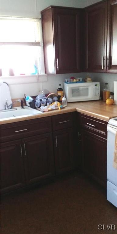 709 East Union Boulevard Bethlehem, PA 18018 - Photo 7 of 10 a kitchen with granite countertop a sink cabinets and window