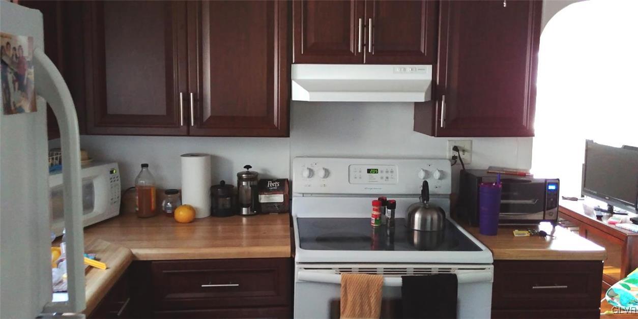 709 East Union Boulevard Bethlehem, PA 18018 - Photo 8 of 10 a kitchen with a stove and a refrigerator