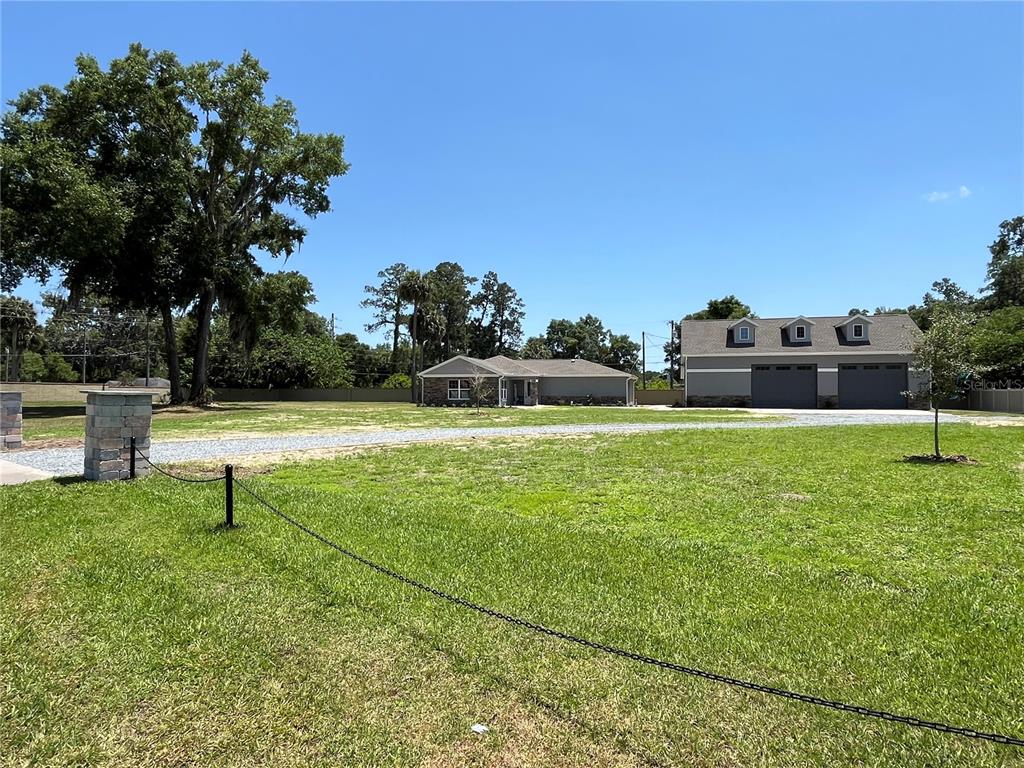 274 Southeast 34th Place Ocala, FL 34471 - Photo 2 of 97 a view of a green field with sitting area
