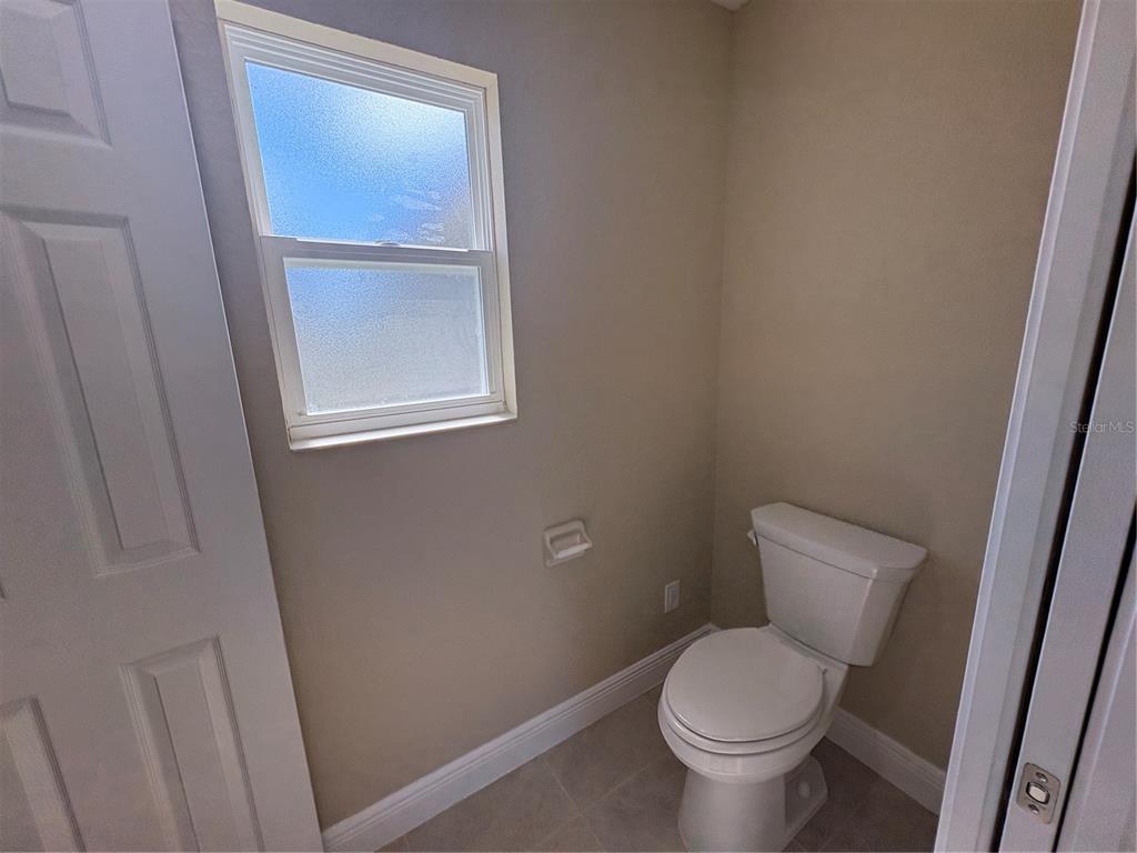 274 Southeast 34th Place Ocala, FL 34471 - Photo 54 of 89 a white toilet sitting next to a small window