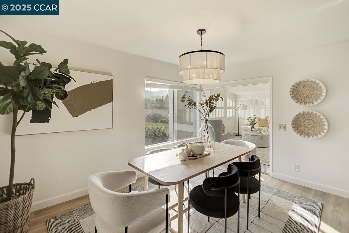 975 Terra California Drive, Unit 1 Walnut Creek, CA 94595 - Photo 18 of 58 a view of a dining room with furniture and wooden floor