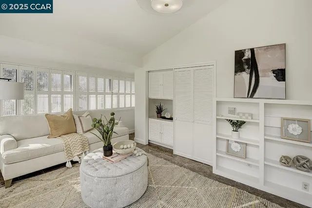 a living room with furniture and a table