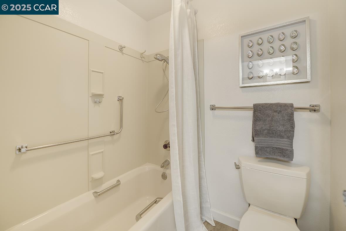 975 Terra California Drive, Unit 1 Walnut Creek, CA 94595 - Photo 37 of 58 a bathroom with a toilet and a shower