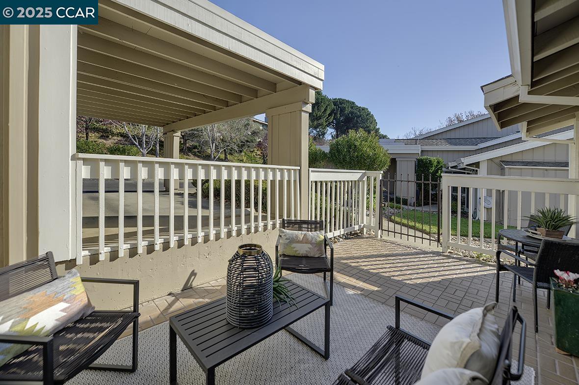 975 Terra California Drive, Unit 1 Walnut Creek, CA 94595 - Photo 5 of 58 a view of a patio with a table and chairs