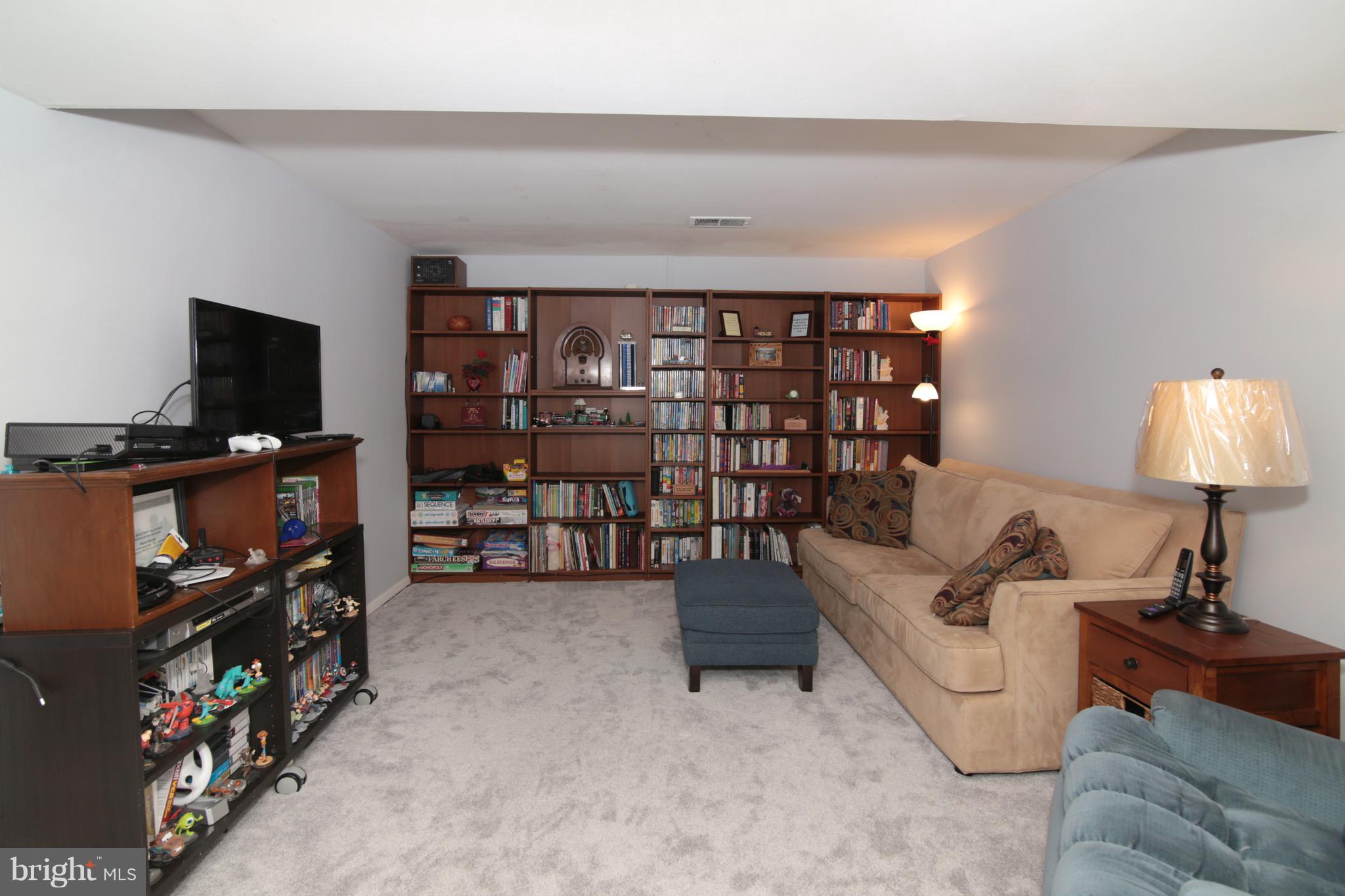 6501 Rivington Road Springfield, VA 22152 - Photo 21 of 30 Family Room with Shelving - Lower Level