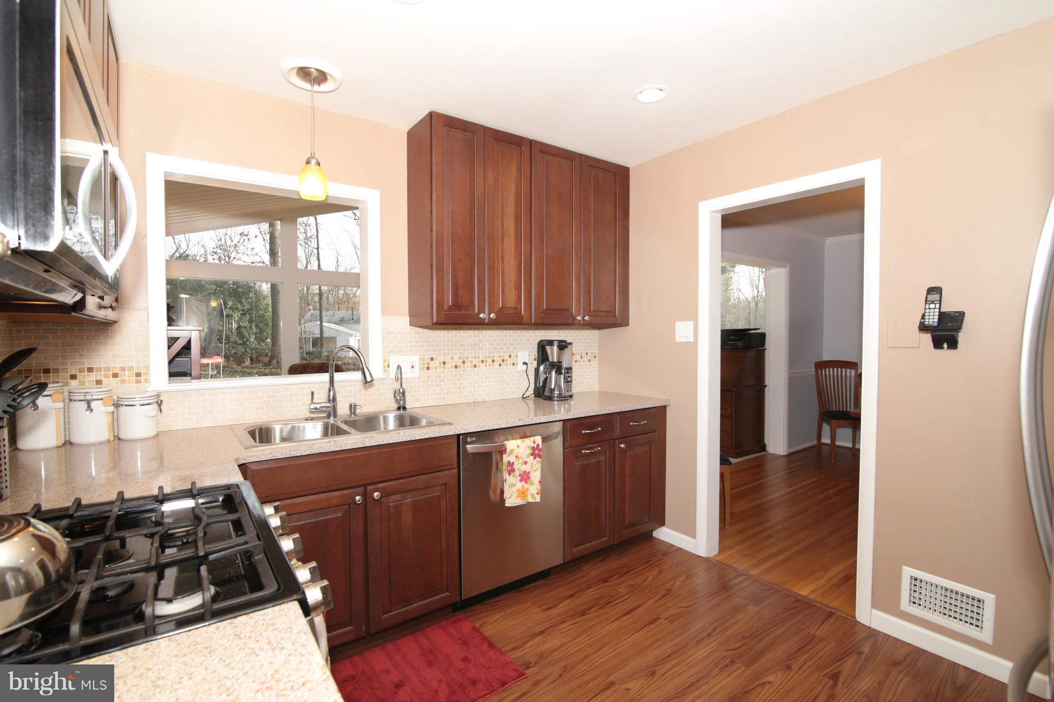 6501 Rivington Road Springfield, VA 22152 - Photo 10 of 30 Kitchen with Pass-Through to Four Season Rm