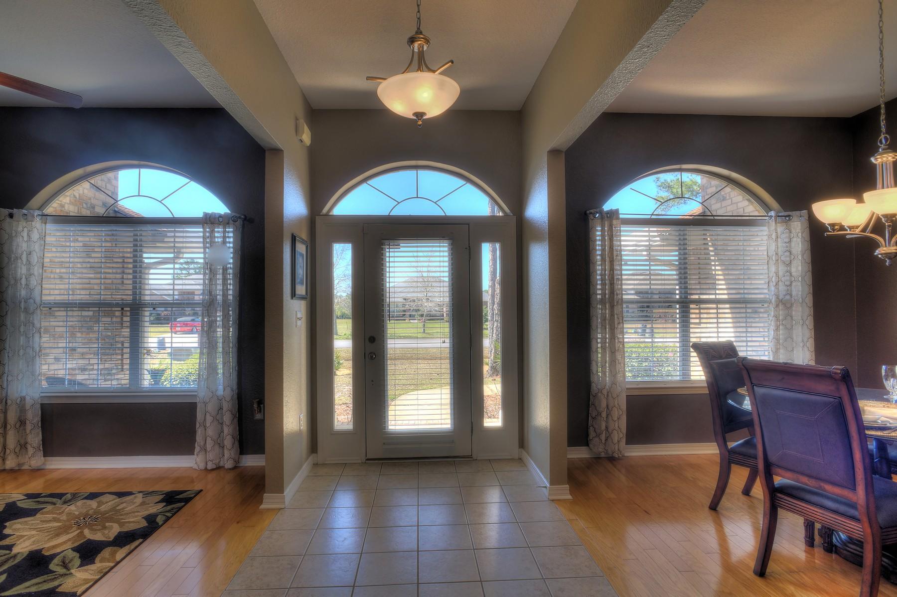 588 East Shipwreck Road Santa Rosa Beach, FL 32459 - Photo 11 of 29 a view of a livingroom with furniture and a chandelier
