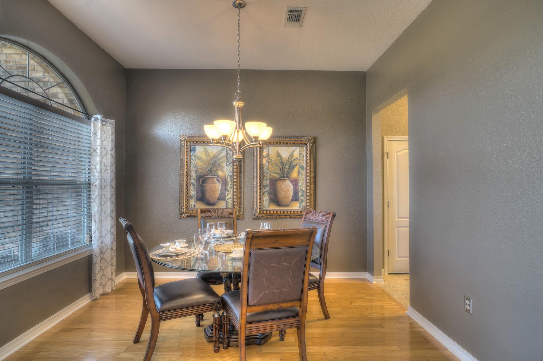 588 East Shipwreck Road Santa Rosa Beach, FL 32459 - Photo 12 of 29 a view of a dining room with furniture a chandelier and wooden floor