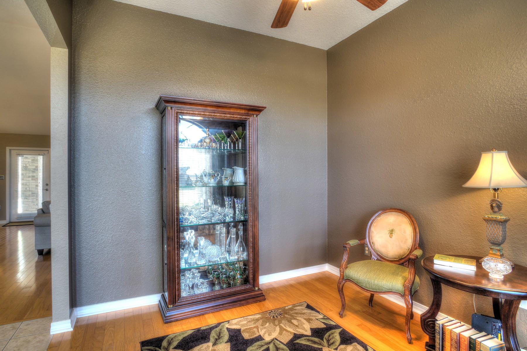588 East Shipwreck Road Santa Rosa Beach, FL 32459 - Photo 13 of 29 a bedroom with a bed and a chandelier