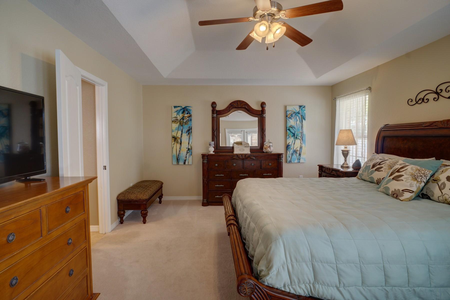 588 East Shipwreck Road Santa Rosa Beach, FL 32459 - Photo 15 of 29 a bedroom with a bed and a flat screen tv