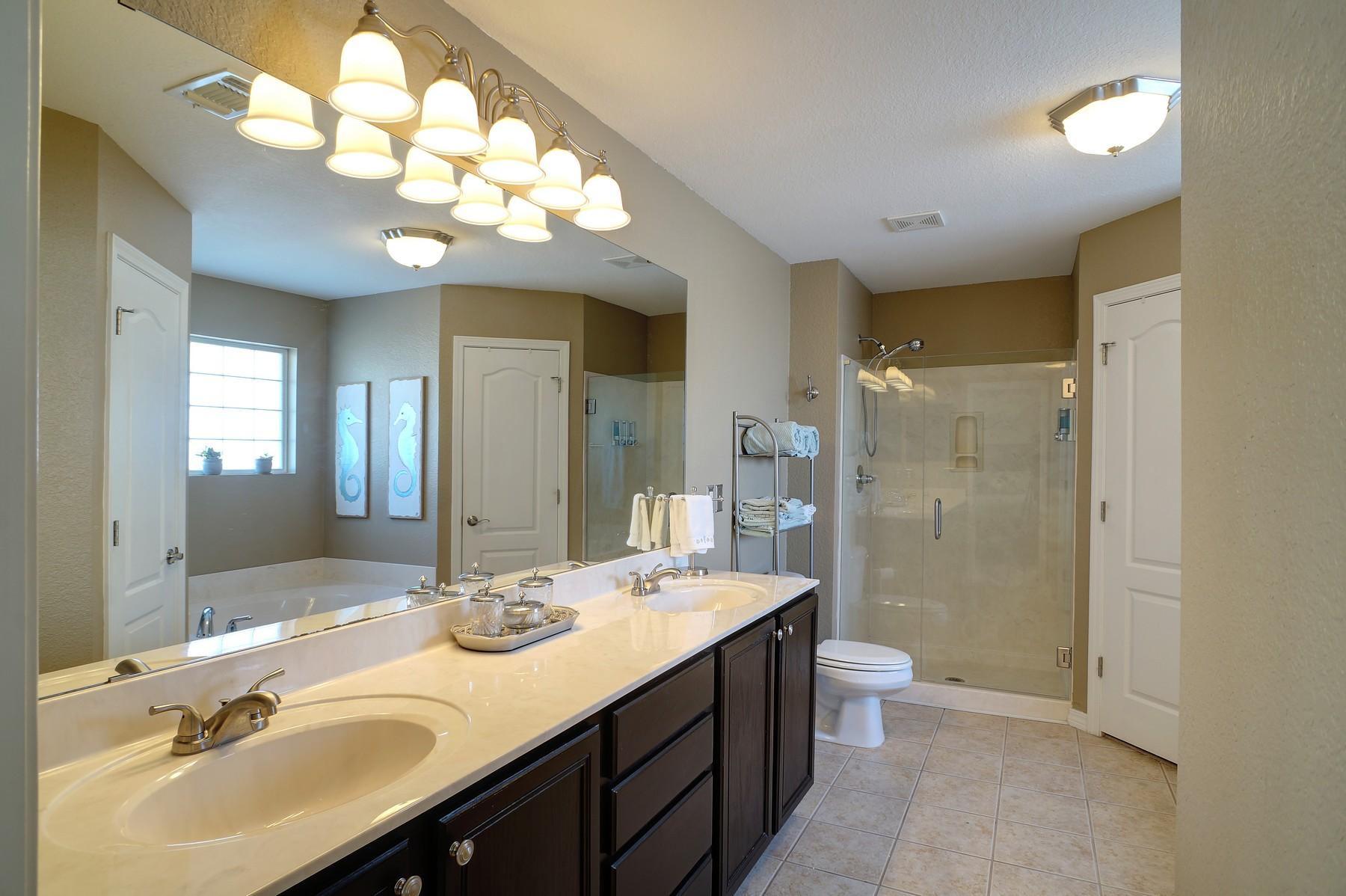 588 East Shipwreck Road Santa Rosa Beach, FL 32459 - Photo 16 of 29 a bathroom with a double vanity sink mirror and toilet