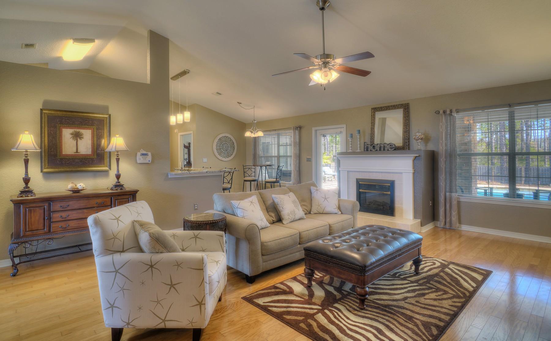 588 East Shipwreck Road Santa Rosa Beach, FL 32459 - Photo 3 of 29 a living room with furniture and a fireplace