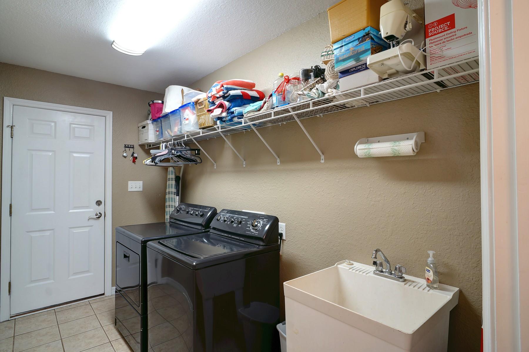 588 East Shipwreck Road Santa Rosa Beach, FL 32459 - Photo 22 of 29 a utility room with dryer and washer