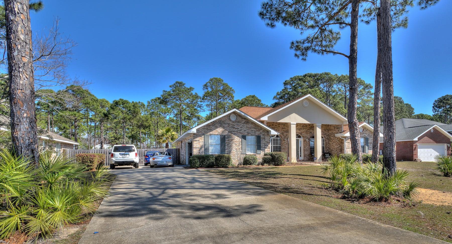 588 East Shipwreck Road Santa Rosa Beach, FL 32459 - Photo 24 of 29 a front view of a house with a yard