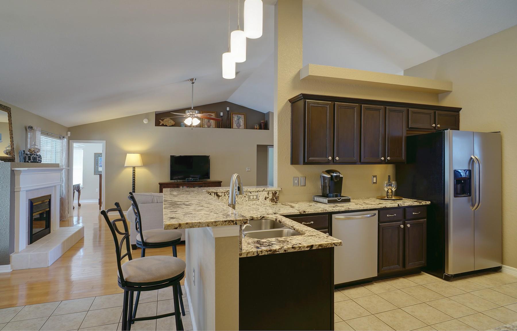 588 East Shipwreck Road Santa Rosa Beach, FL 32459 - Photo 8 of 29 a kitchen with cabinets and chairs