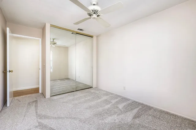 an empty room with a bathroom