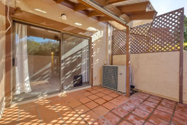 a view of a door and wooden floor