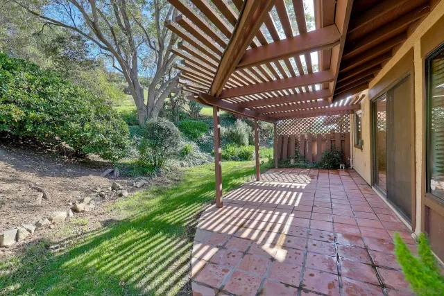 a view of a patio with a yard