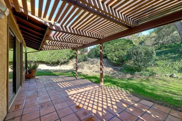 a view of a patio with a yard