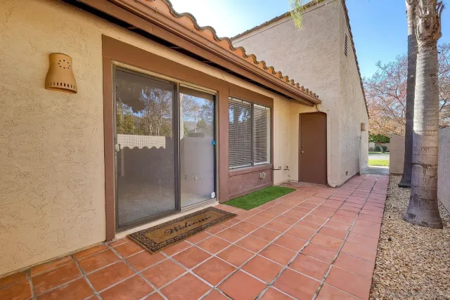 a backyard of a house with shower and yard