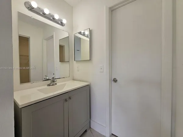 a white toilet sitting next to a bath tub
