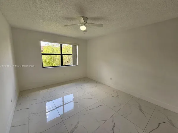 an empty room with a bathroom