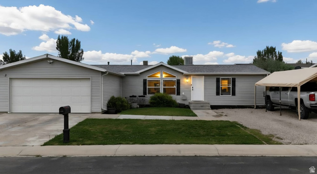 401 West 2000th Street South Vernal, UT 84078 - Photo 26 of 26 Ranch-style residence featuring light gray siding, an attached two-car garage, and a covered front entry