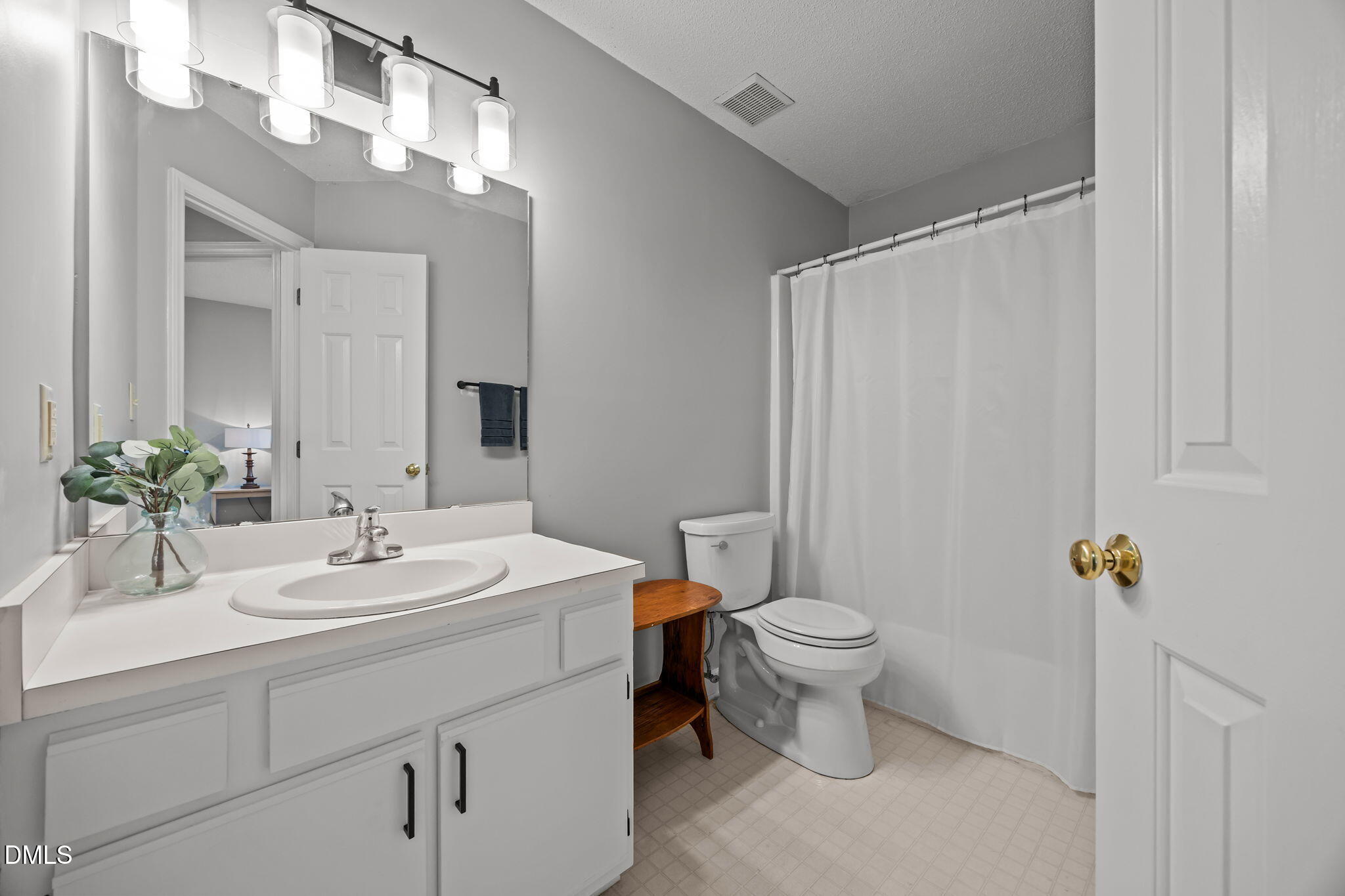 1626 Oakland Hills Way Raleigh, NC 27604 - Photo 12 of 23 a bathroom with a toilet sink and mirror