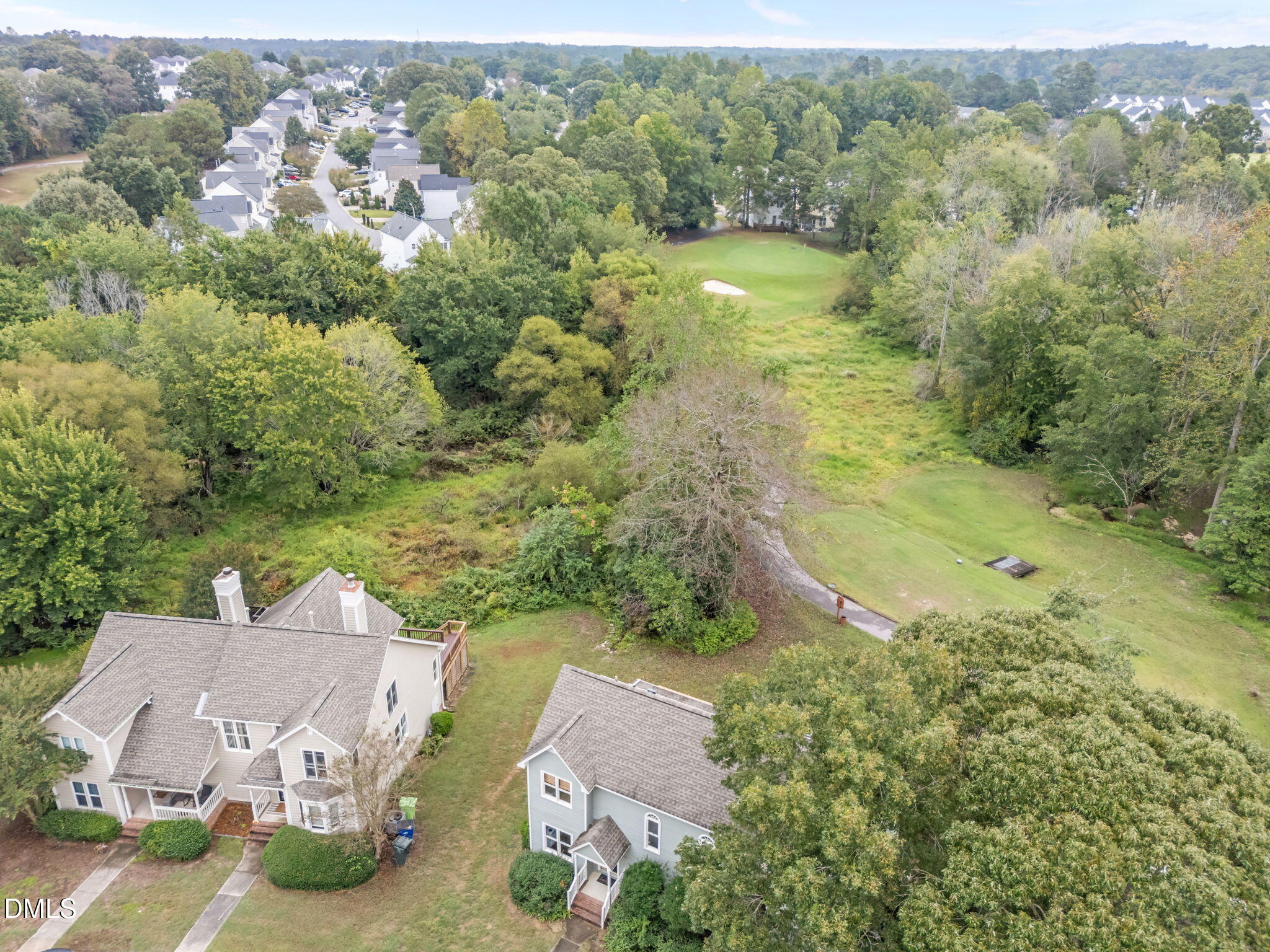 1626 Oakland Hills Way Raleigh, NC 27604 - Photo 19 of 23 an aerial view of a house with a garden and lake view