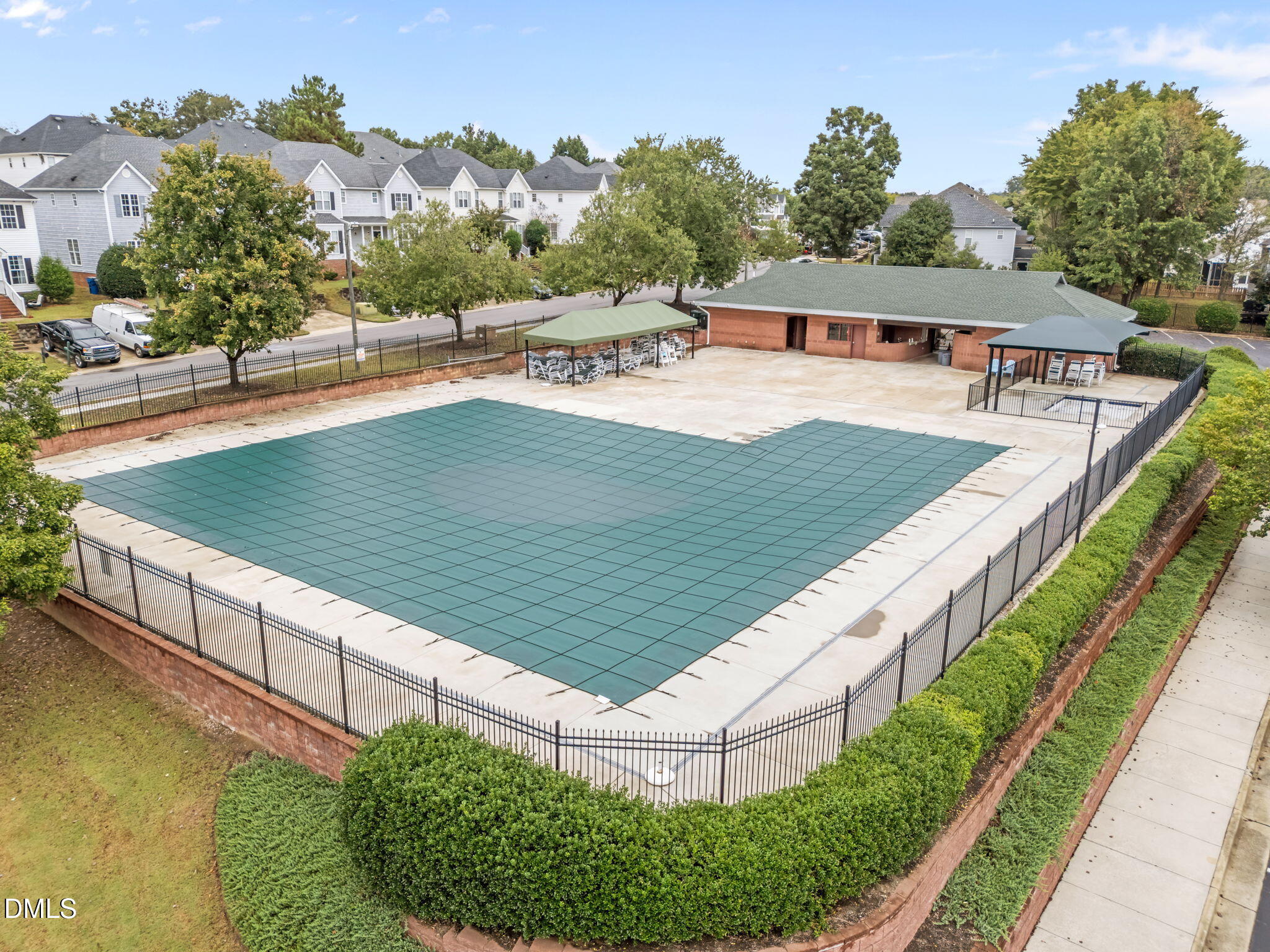 1626 Oakland Hills Way Raleigh, NC 27604 - Photo 20 of 23 a view of a swimming pool with a patio