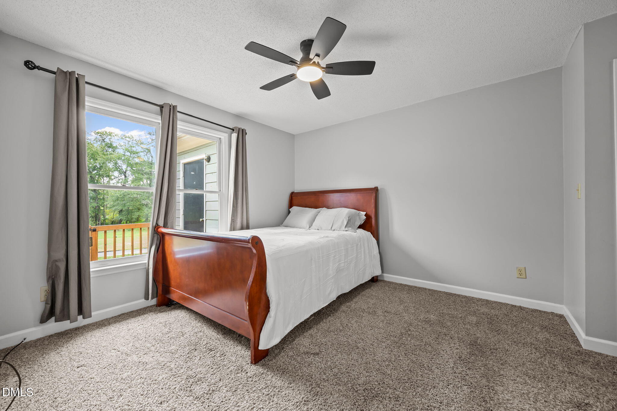 1626 Oakland Hills Way Raleigh, NC 27604 - Photo 10 of 23 a bed sitting in a room next to a window