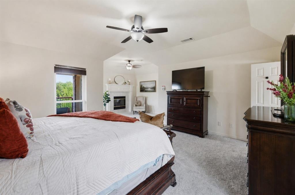 1820 Winningkoff Road Lucas, TX 75002 - Photo 20 of 40 Primary Bedroom with fireplace.
