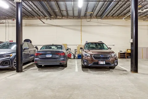 a view of cars parked in a parking garage