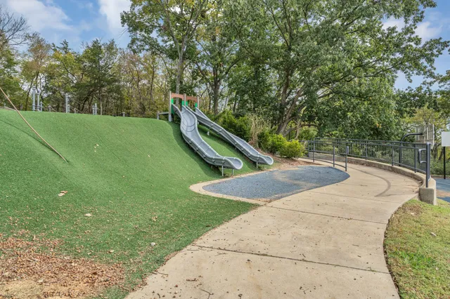 a view of a backyard with swimming pool