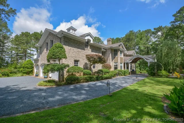 a front view of a house with swimming pool