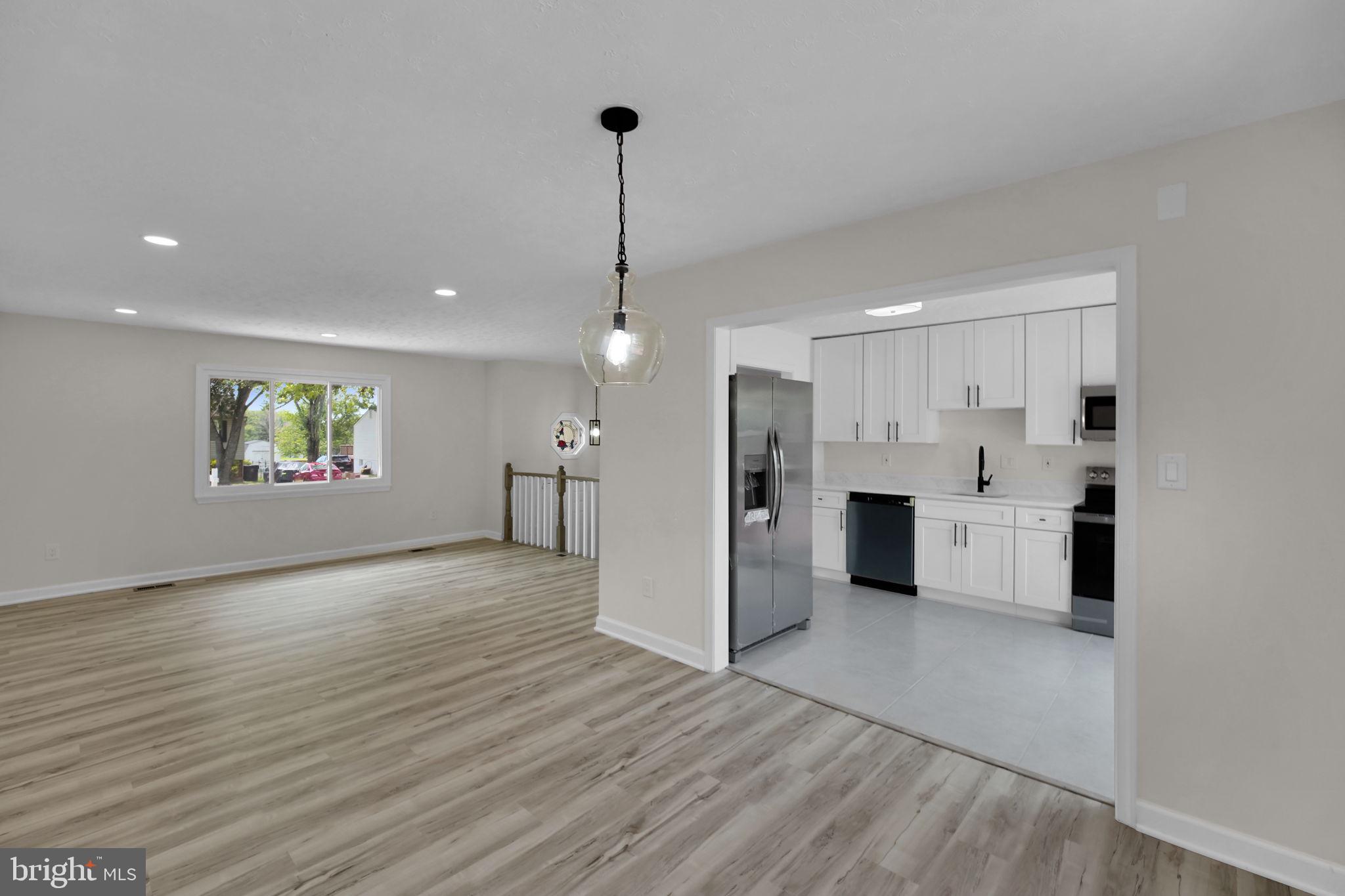 8613 Weems Road Manassas, VA 20110 - Photo 44 of 50 a view of a kitchen with refrigerator and windows