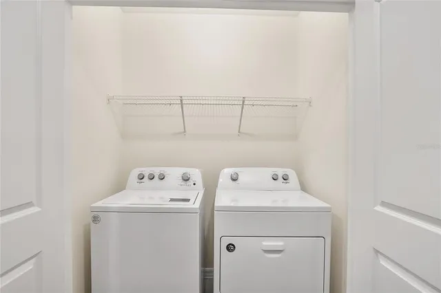 swimming pool view with a seating space